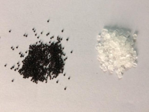 Minuscule sized black seed-bead from Papanaidu Peta in comparison to sugar